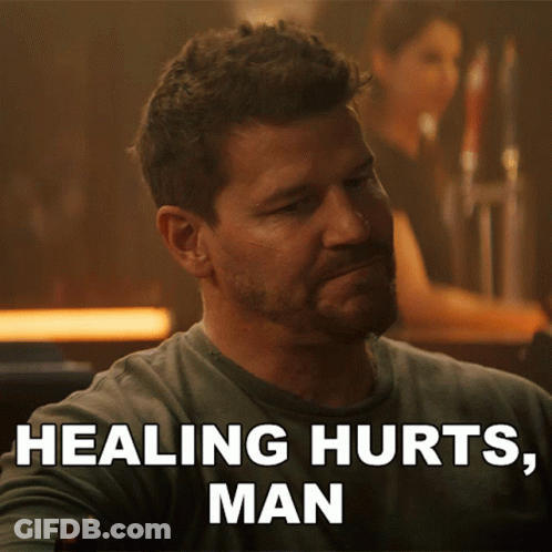 A Man Sitting At A Bar With The Words Healing Hurts Man Behind Him GIF