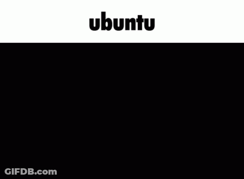 A Man Sitting At A Desk Using A Laptop With The Word Ubuntu On The Bottom GIF