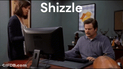 A Man Sitting At A Desk With A Computer And The Word Shizzle Behind Him GIF