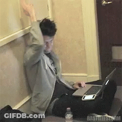 A Man Sitting At A Desk With A Laptop And A Bottle Of Water With The Word Bastillestorm On The Bottom GIF