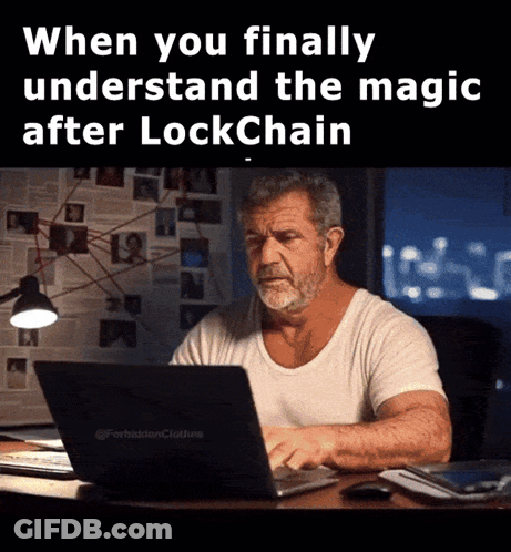 A Man Sitting At A Desk With A Laptop And The Words When You Finally Understand The Magic After Lockchain GIF