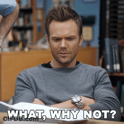 A Man Sitting At A Desk With His Arms Crossed And The Words " What Why Not " Written On The Bottom GIF