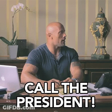 A Man Sitting At A Desk With The Words Call The President Written On It GIF