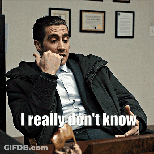 A Man Sitting At A Desk With The Words " I Really Don 'T Know " On The Bottom GIF