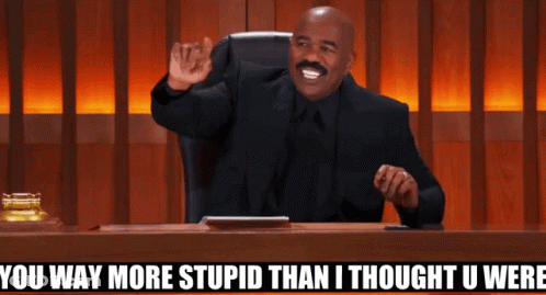 A Man Sitting At A Desk With The Words " You Way More Stupid Than I Thought U Were " Above Him GIF