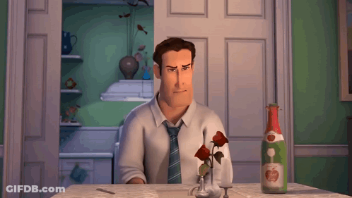 A Man Sitting At A Table With A Bottle Of Apple Juice GIF
