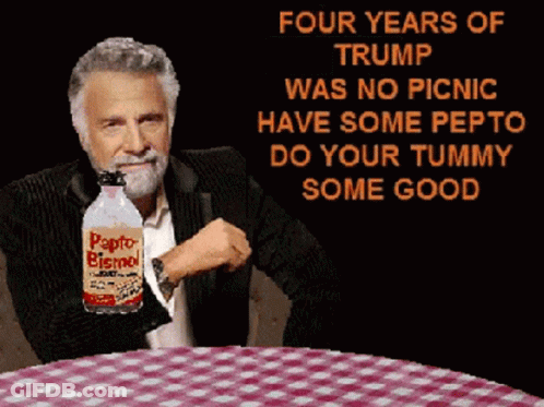 A Man Sitting At A Table With A Bottle Of Papto Bismol In His Hand GIF