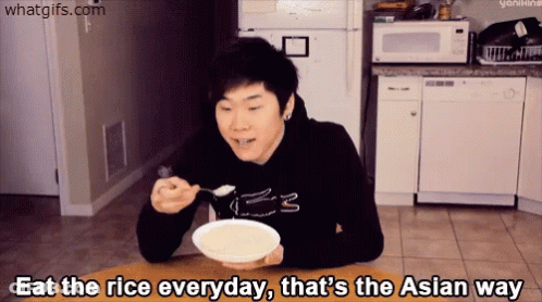 A Man Sitting At A Table With A Bowl Of Rice And The Words Eat The Rice Everyday GIF