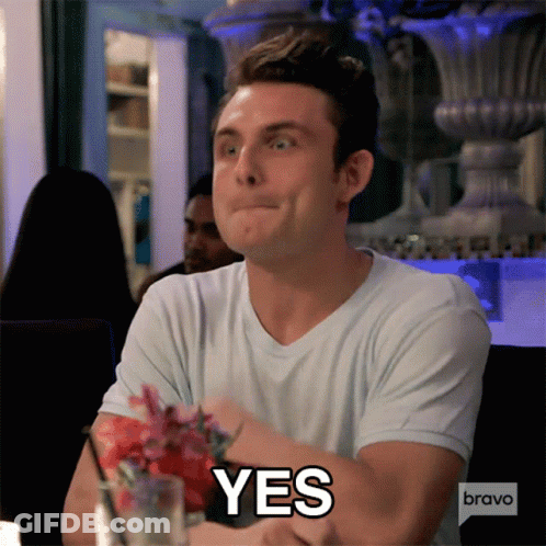 A Man Sitting At A Table With A Bravo Logo On His Speech Bubble GIF