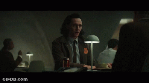 A Man Sitting At A Table With A Can Of Soda And The Word Anyway On The Bottom GIF