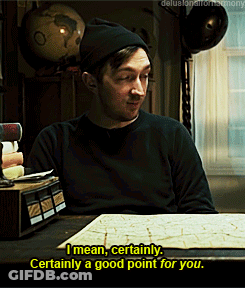 A Man Sitting At A Table With A Globe In The Background Says " I Mean Certainly " GIF