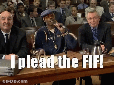 A Man Sitting At A Table With A Microphone And The Words I Plead The Ff GIF