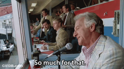 A Man Sitting At A Table With A Microphone Says So Much For That GIF