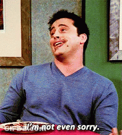 A Man Sitting At A Table With A Plate Of Food And Says I 'M Not Even Sorry GIF