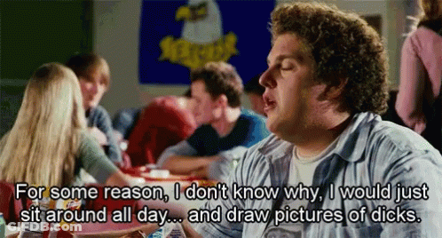 A Man Sitting At A Table With A Sign That Says Xtreme GIF