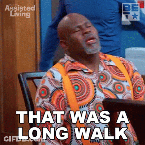 A Man Sitting At A Table With His Eyes Closed And Says That Was A Long Walk GIF