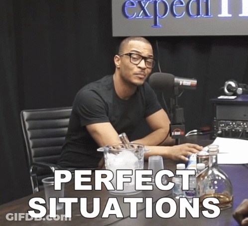 A Man Sitting At A Table With Perfect Situations Written On The Table GIF