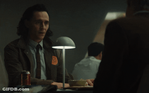 A Man Sitting At A Table With The Word Anyway On The Bottom Right GIF