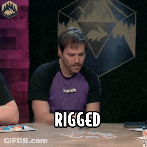 A Man Sitting At A Table With The Word Rigged Written On It GIF