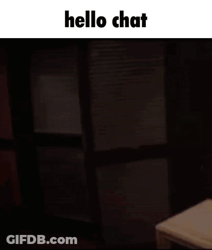 A Man Sitting At A Table With The Words Hello Chat On The Top GIF