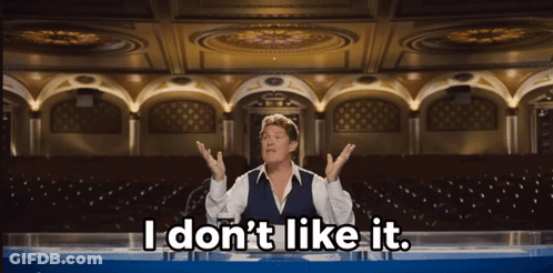 A Man Sitting At A Table With The Words " I Don 'T Like It " Above Him GIF