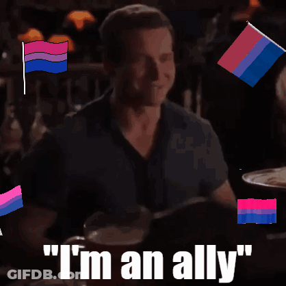 A Man Sitting At A Table With The Words " I 'M An Ally " GIF