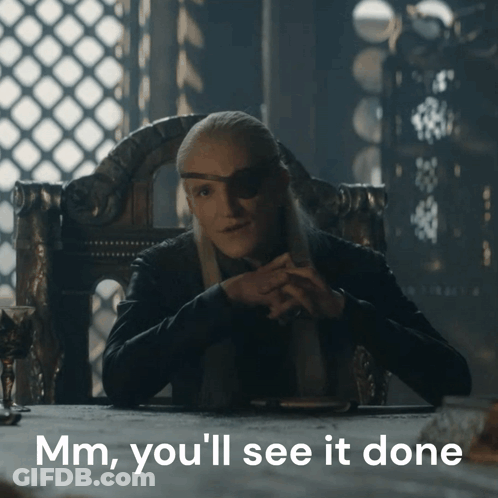A Man Sitting At A Table With The Words Mm You 'Ll See It Done On The Bottom GIF