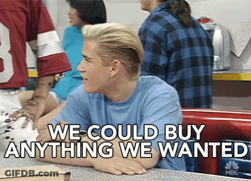 A Man Sitting At A Table With The Words " We Could Buy Anything We Wanted " On The Bottom GIF