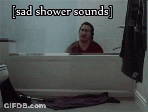 A Man Sitting In A Bathtub With The Words Sad Shower Sounds Above Him GIF