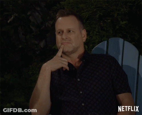 A Man Sitting In A Blue Chair With A Netflix Logo On The Bottom Right GIF