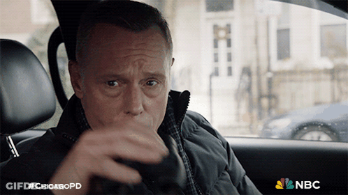 A Man Sitting In A Car With #Chicagopd On The Bottom GIF
