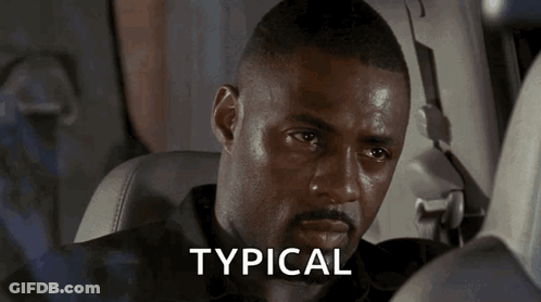 A Man Sitting In A Car With The Word Typical Written On The Screen GIF