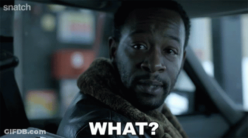 A Man Sitting In A Car With The Word What On His Face GIF