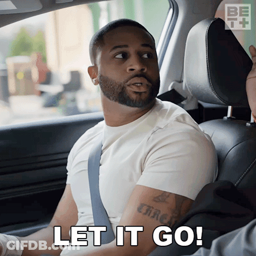 A Man Sitting In A Car With The Words Let It Go On The Bottom GIF