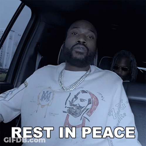 A Man Sitting In A Car With The Words Rest In Peace Written Below Him GIF