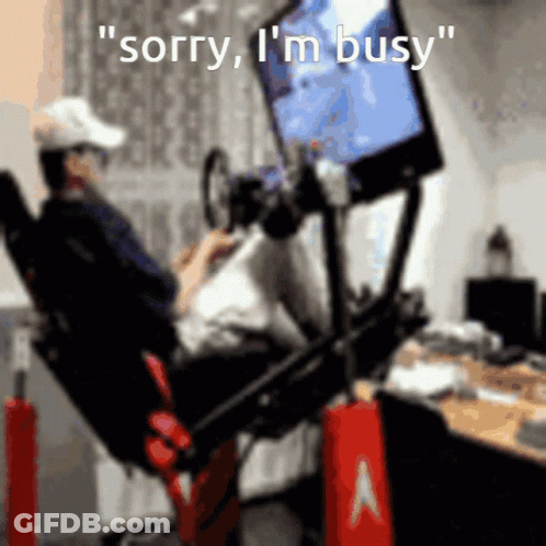 A Man Sitting In A Chair Playing A Video Game With The Words " Sorry I 'M Busy " GIF