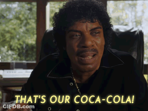 A Man Sitting In A Chair Says That 'S Our Coca Cola GIF