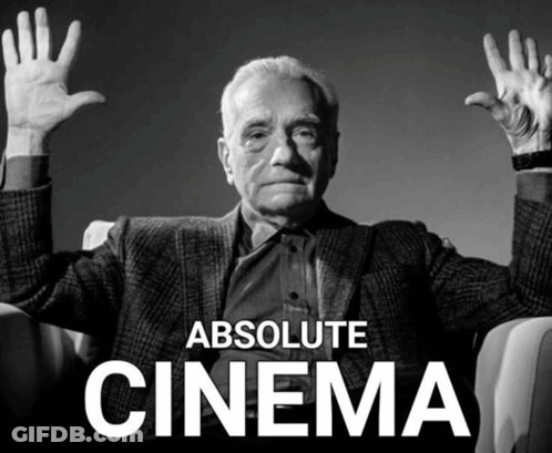 A Man Sitting In A Chair With His Hands In The Air And The Words Absolute Cinema Above Him GIF
