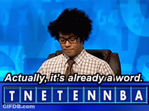 A Man Sitting In A Chair With The Words " Actually It 'S Already A Word " Above Him GIF