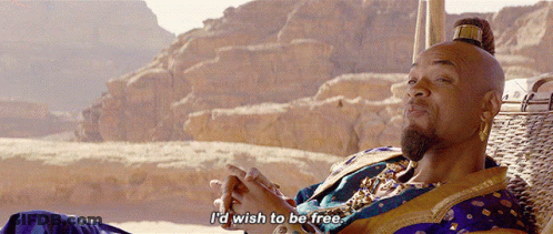 A Man Sitting In A Chair With The Words " I 'D Wish To Be Free " Below Him GIF