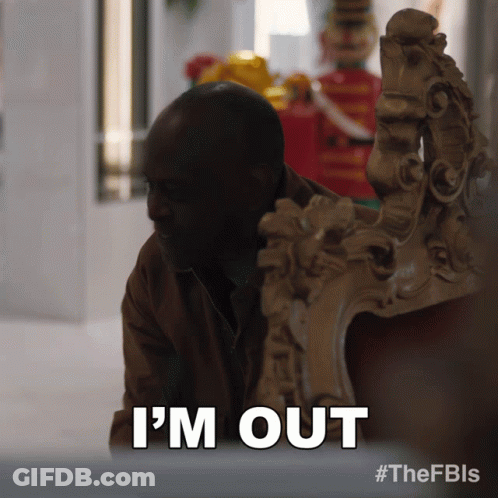 A Man Sitting In A Chair With The Words I 'M Out Above Him GIF