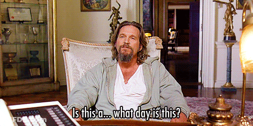 A Man Sitting In A Chair With The Words Is This A What Day Is This Written Below Him GIF