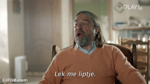 A Man Sitting In A Chair With The Words Lek Me Liptje On The Screen GIF