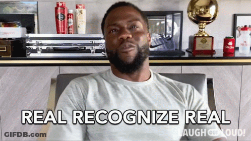 A Man Sitting In A Chair With The Words Real Recognize Real GIF