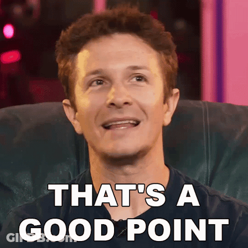 A Man Sitting In A Chair With The Words That 'S A Good Point Written On His Face GIF