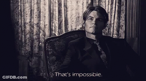 A Man Sitting In A Chair With The Words That 'S Impossible On The Bottom GIF