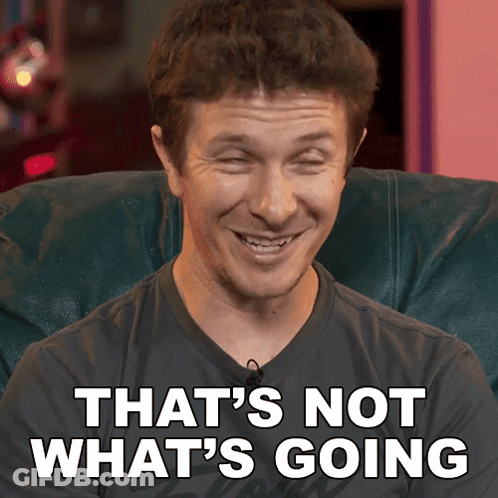 A Man Sitting In A Chair With The Words That 'S Not What 'S Going Behind Him GIF