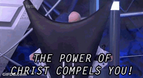 A Man Sitting In A Chair With The Words " The Power Of Christ Compels You " GIF