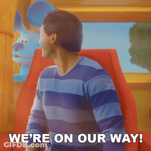 A Man Sitting In A Chair With The Words We 'Re On Our Way GIF