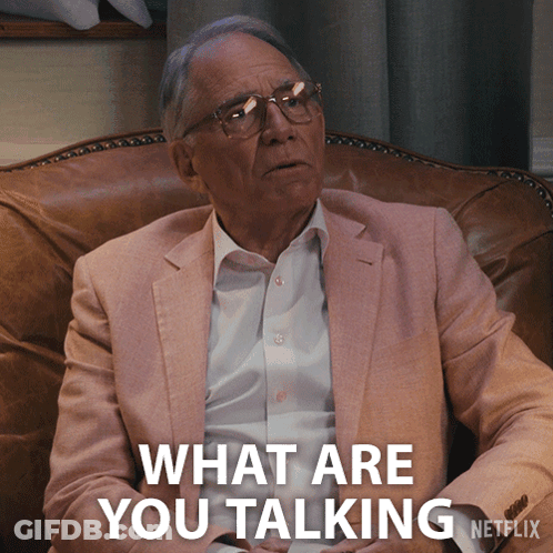 A Man Sitting In A Chair With The Words What Are You Talking Netflix Behind Him GIF
